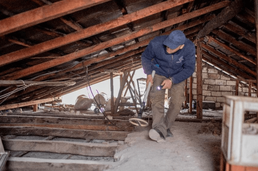 HALO deminer checking the attic of a private house in Stepanakert