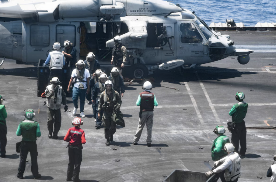 Sailors from the Dwight D. Eisenhower Carrier Strike Group assist distressed seafarers who were rescued from the Liberian-flagged, Greek-owned bulk carrier M/V Tutor after it was attacked by Houthis in the Red Sea on 15 June 2024. Reuters.