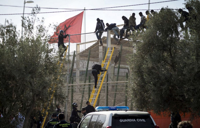 Migrants die as they try to force their way into the Spanish enclave of Melilla