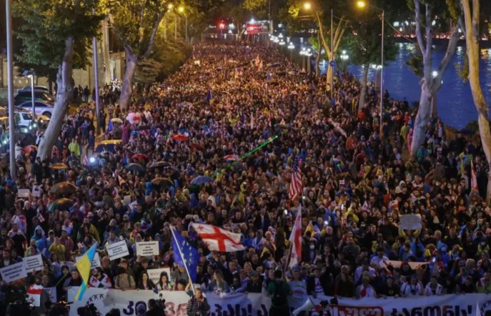 Tens of thousands take to the streets of Tbilisi to protest against represssive law