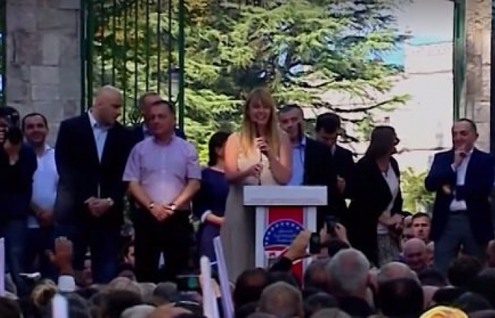 Saakashvili addresses UNM supporters via video link. Wife says he will return to Georgia "even if he has to dig a tunnel"