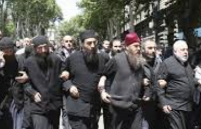 Georgia's Day of shame Huge outcry after Orthodox priests lead mob in violent breakup of peaceful rally